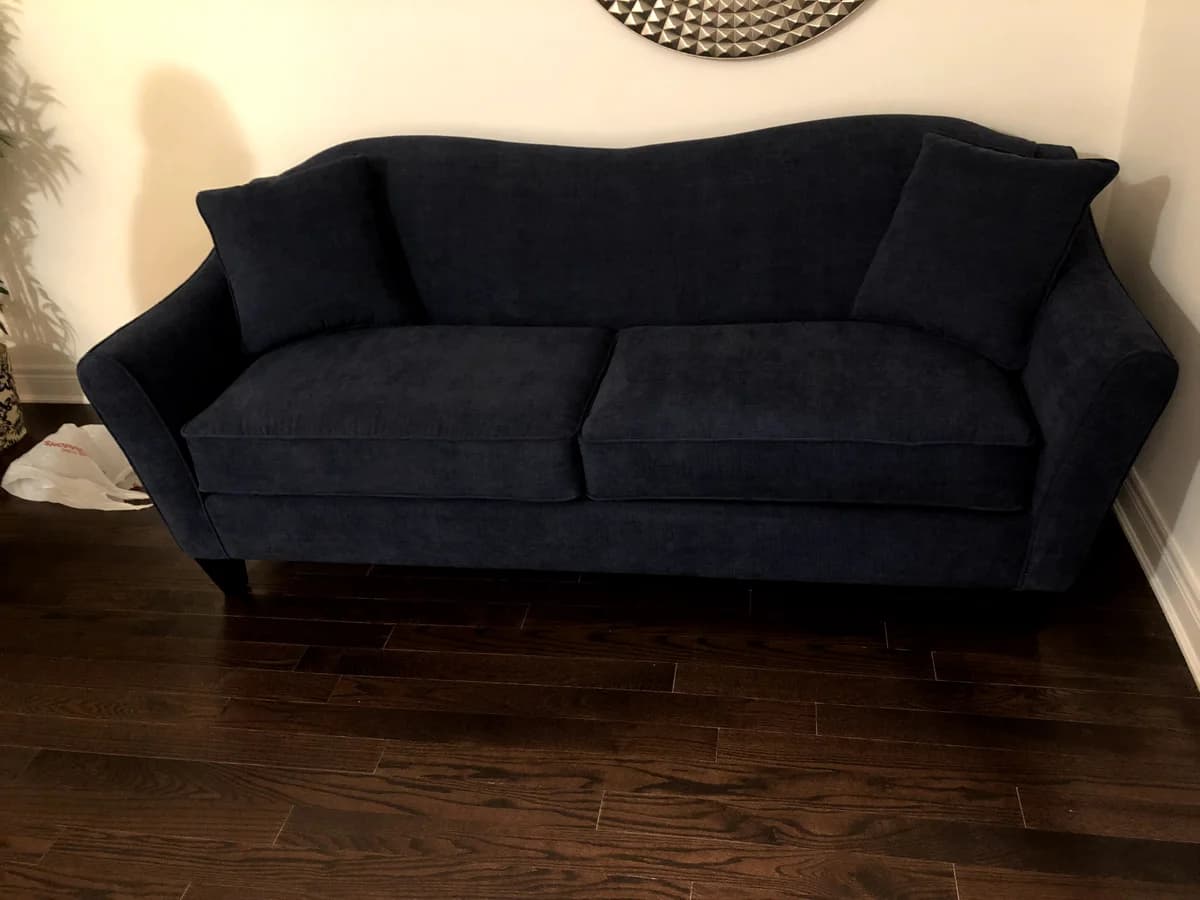 sofa upholstered with blue velvet