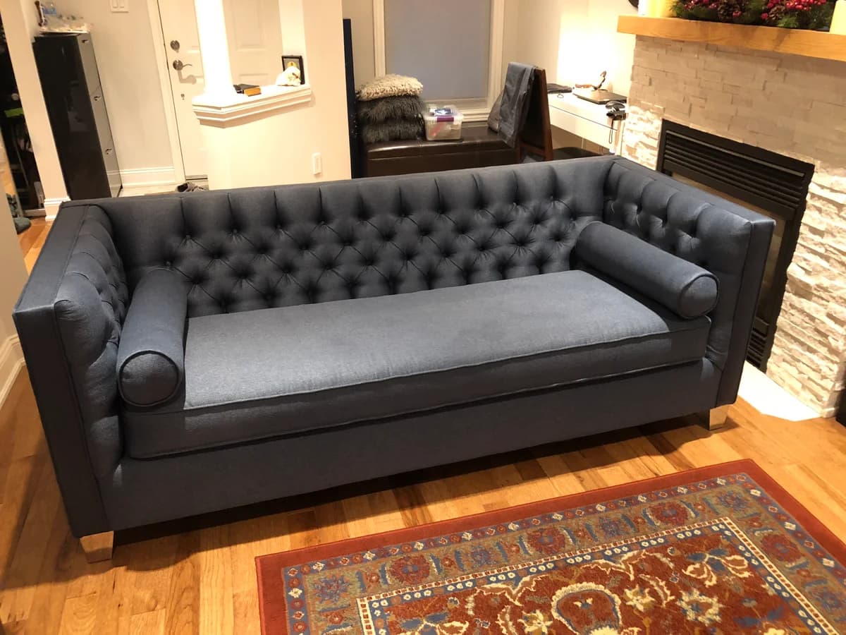 tufted sofa upholstered with unique blue fabric