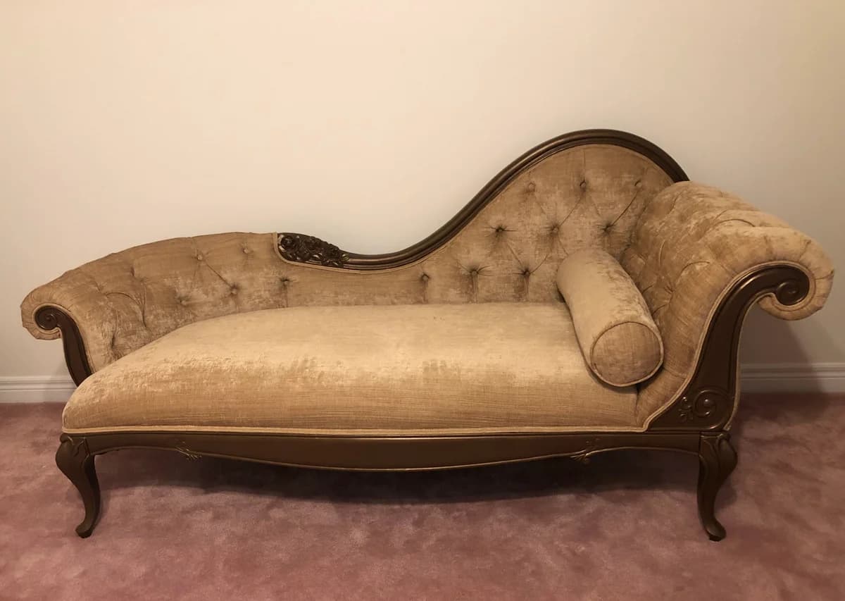 chaise lounge upholstered with shiny gold microfibre
