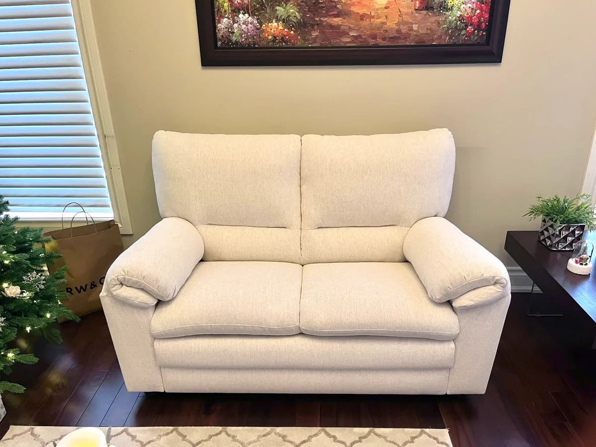 Love seat upholstered with off white crypton stain resistance fabric