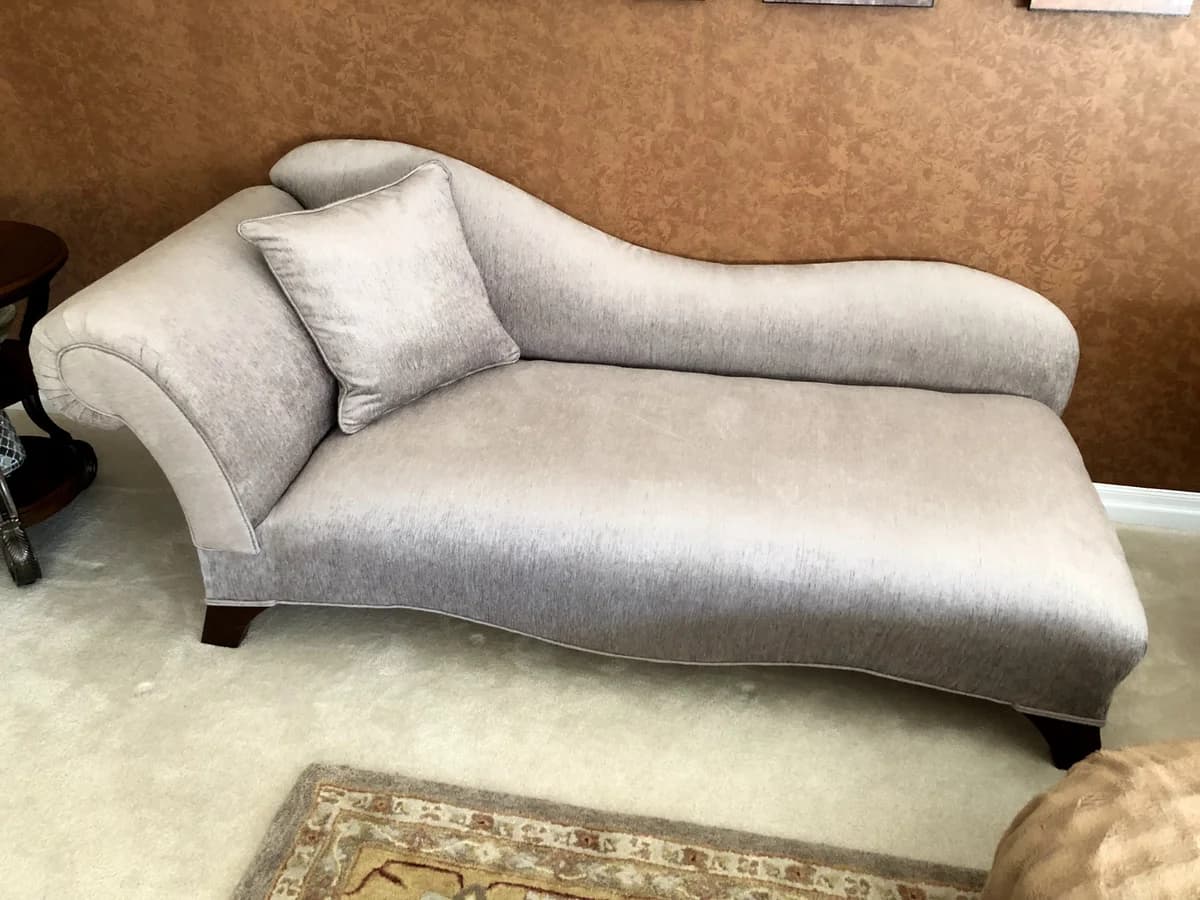 chaise lounge upholstered with shiny grey velvet