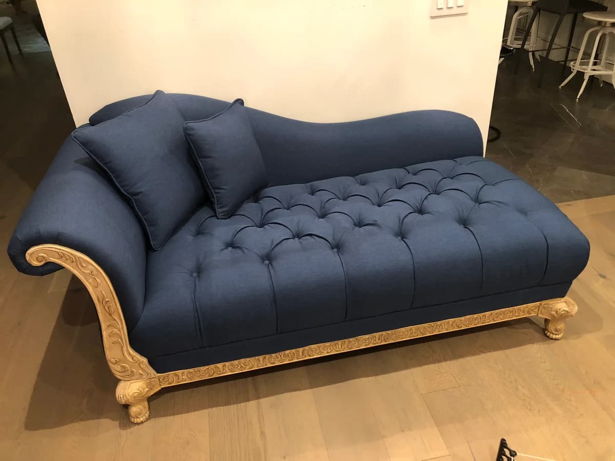 chaise lounge upholstered with blue fabric